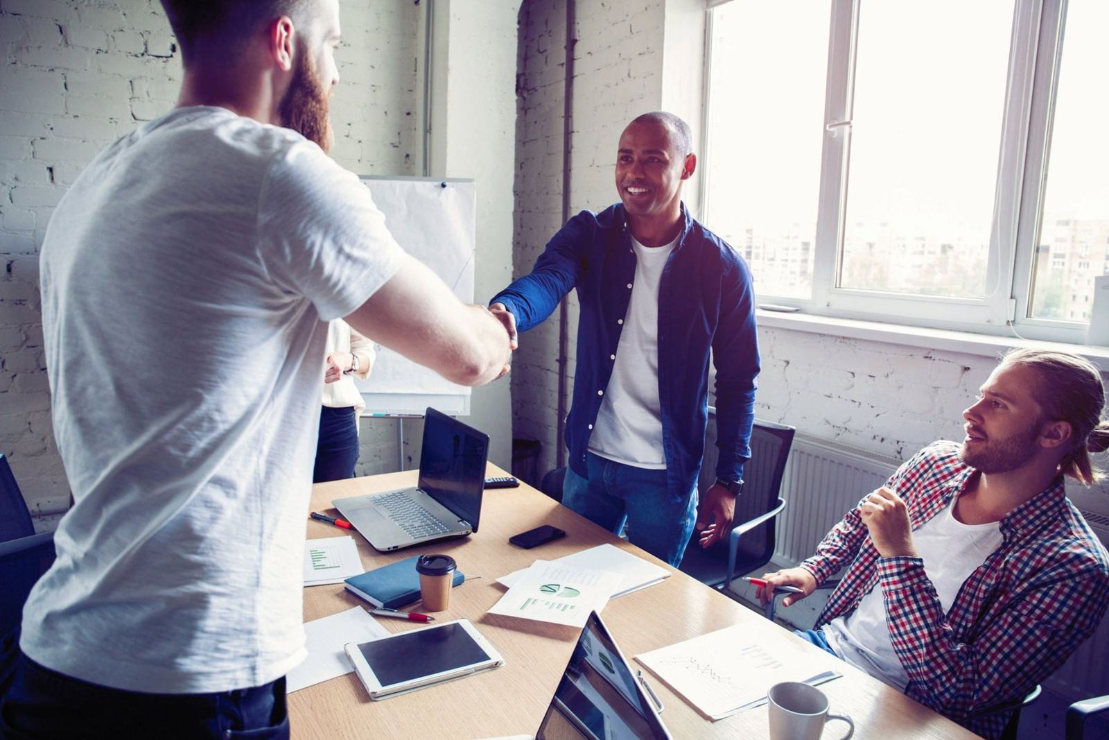 Business owners shaking hands in a meeting